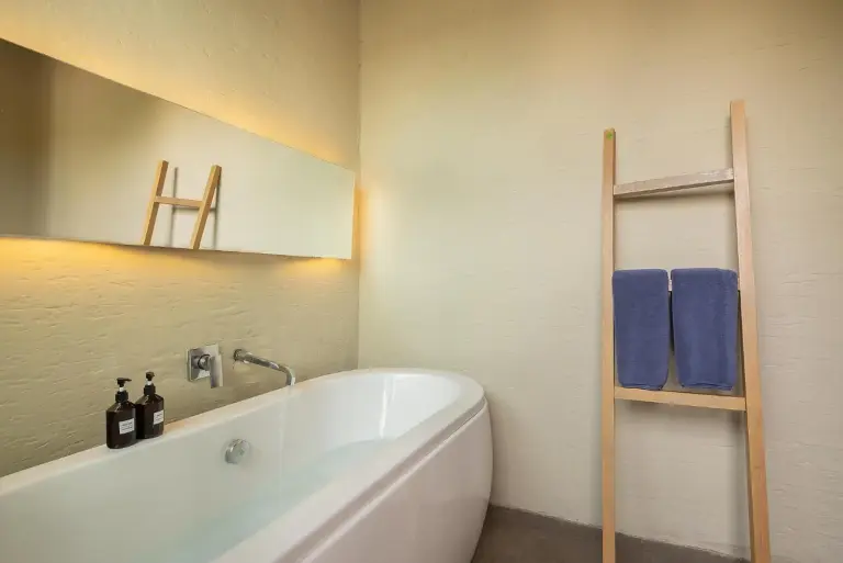 Bathroom with bathtub at Sunday Sea Two Pool Villa Pattaya featuring a freestanding tub and towels