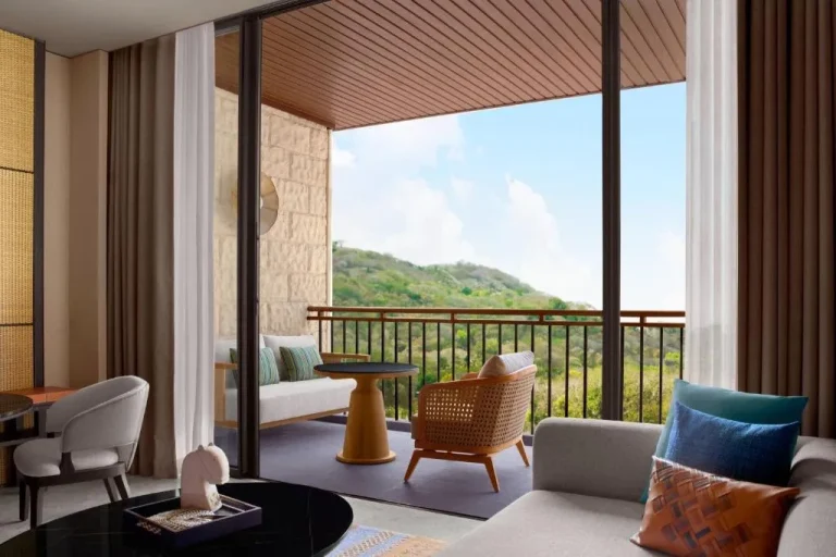 Balcony seating area in TA’AKTANA, Labuan Bajo with mountain views