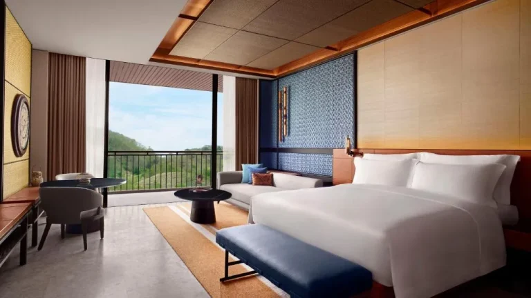 Luxury bedroom at TA’AKTANA, Labuan Bajo with mountain views