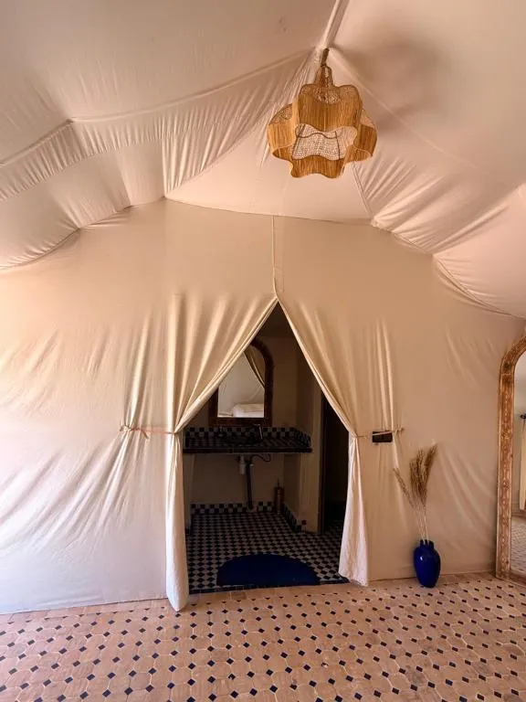 Tent entrance and sink area at Tamazirt Desert Camp in Merzouga