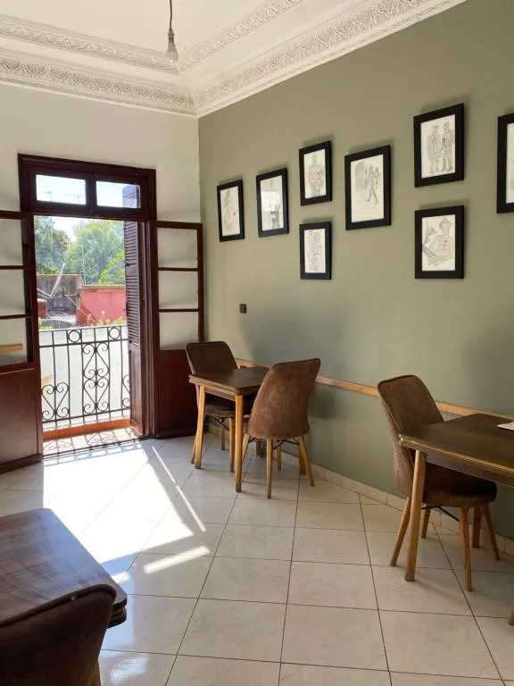 Dining area with natural light at TANJALUCIA HOSTeL in Tangier