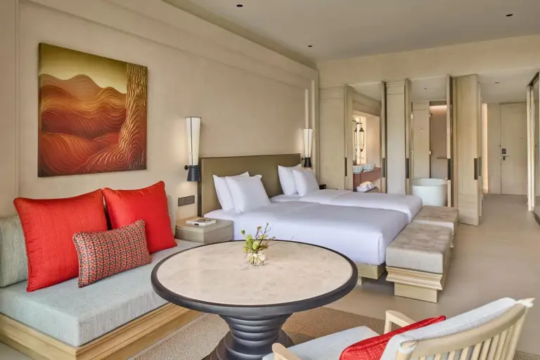 The Barai Hua Hin guest room with double beds and stylish decor