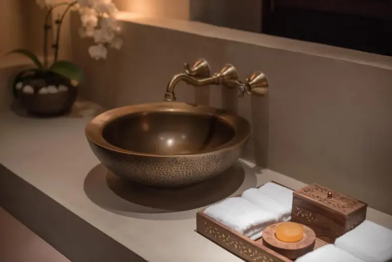 The Chedi Al Bait luxurious bronze sink with amenities