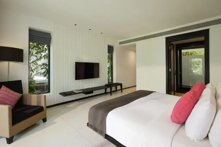 Cozy guest room at The Chill Resort and Spa, Koh Chang with seating area.