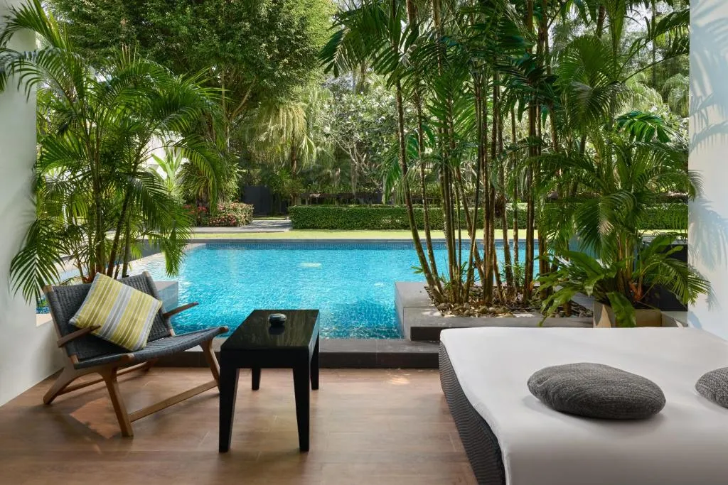 Inviting pool area at The Chill Resort and Spa, Koh Chang surrounded by lush greenery.