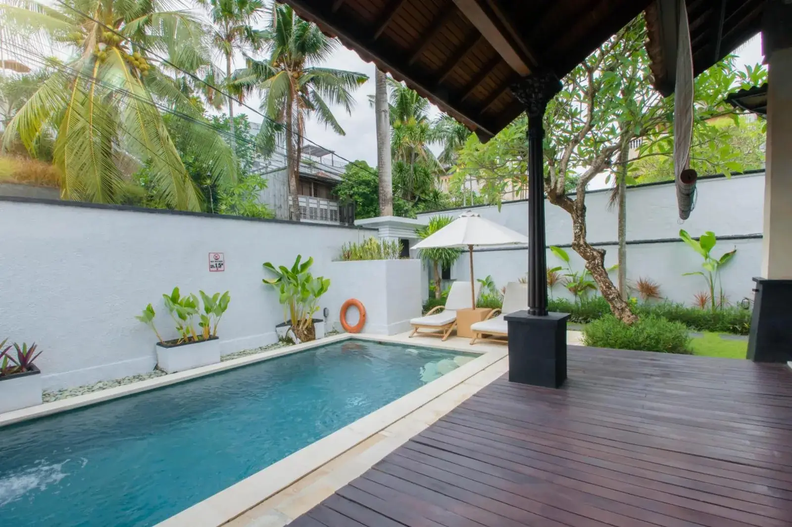 Charming poolside area at The Club Villas Seminyak