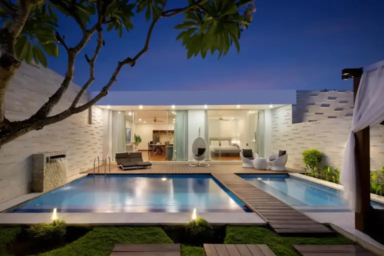 The Daha Luxury Villas evening poolside view