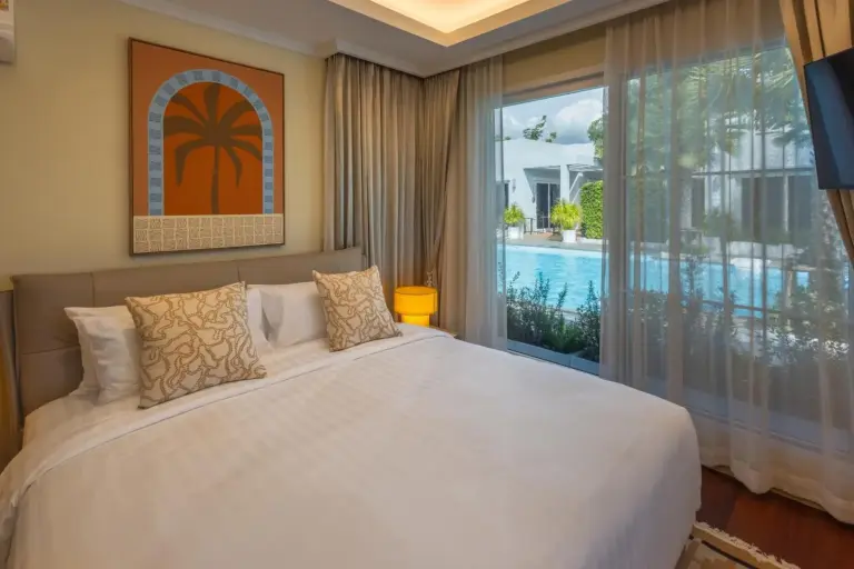 Bedroom with pool view at The Delfini Hua Hin