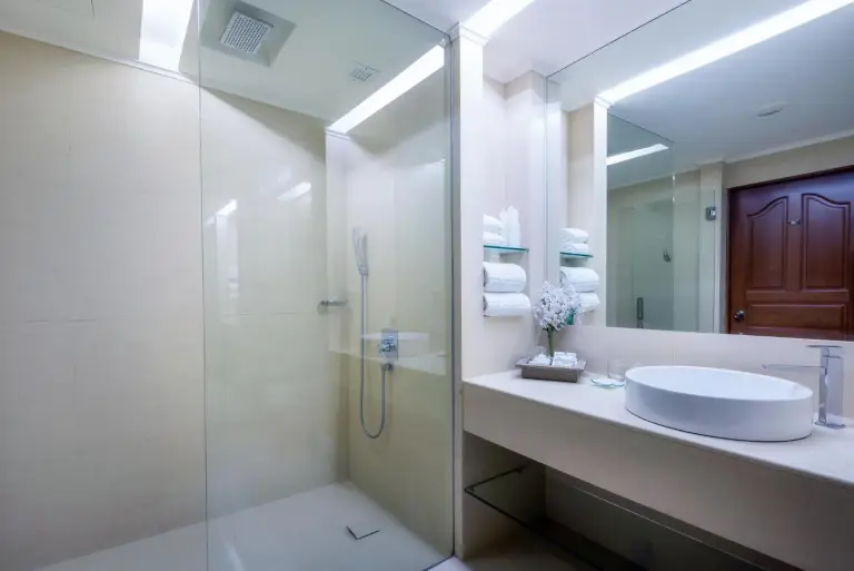 Modern bathroom with glass shower at The Emerald Hotel Bangkok Ratchada in Bangkok