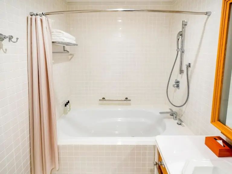 An elegant bathroom at The Fujiya Hotel in Hakone showcasing premium fixtures and a relaxing atmosphere.