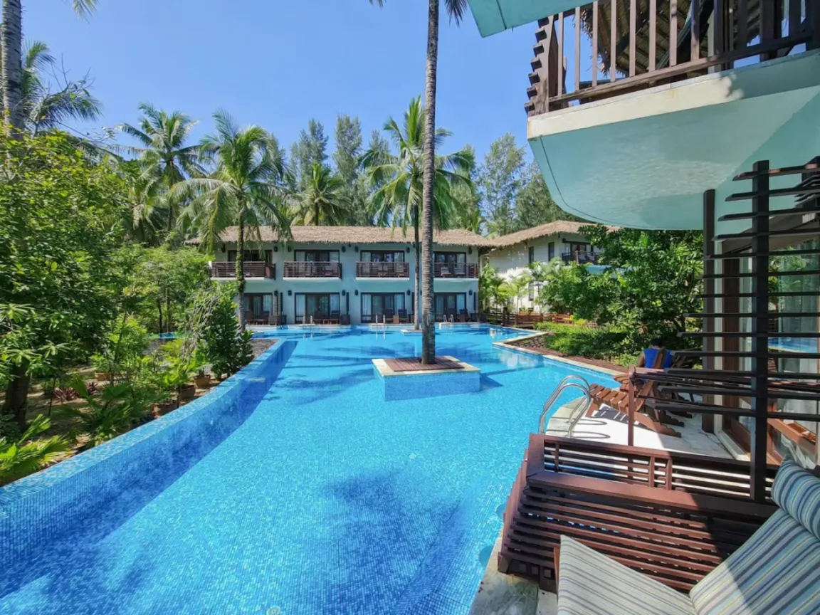 Resort pool view at The Haven Khao Lak in Khao Lak with tropical greenery and balcony seating.
