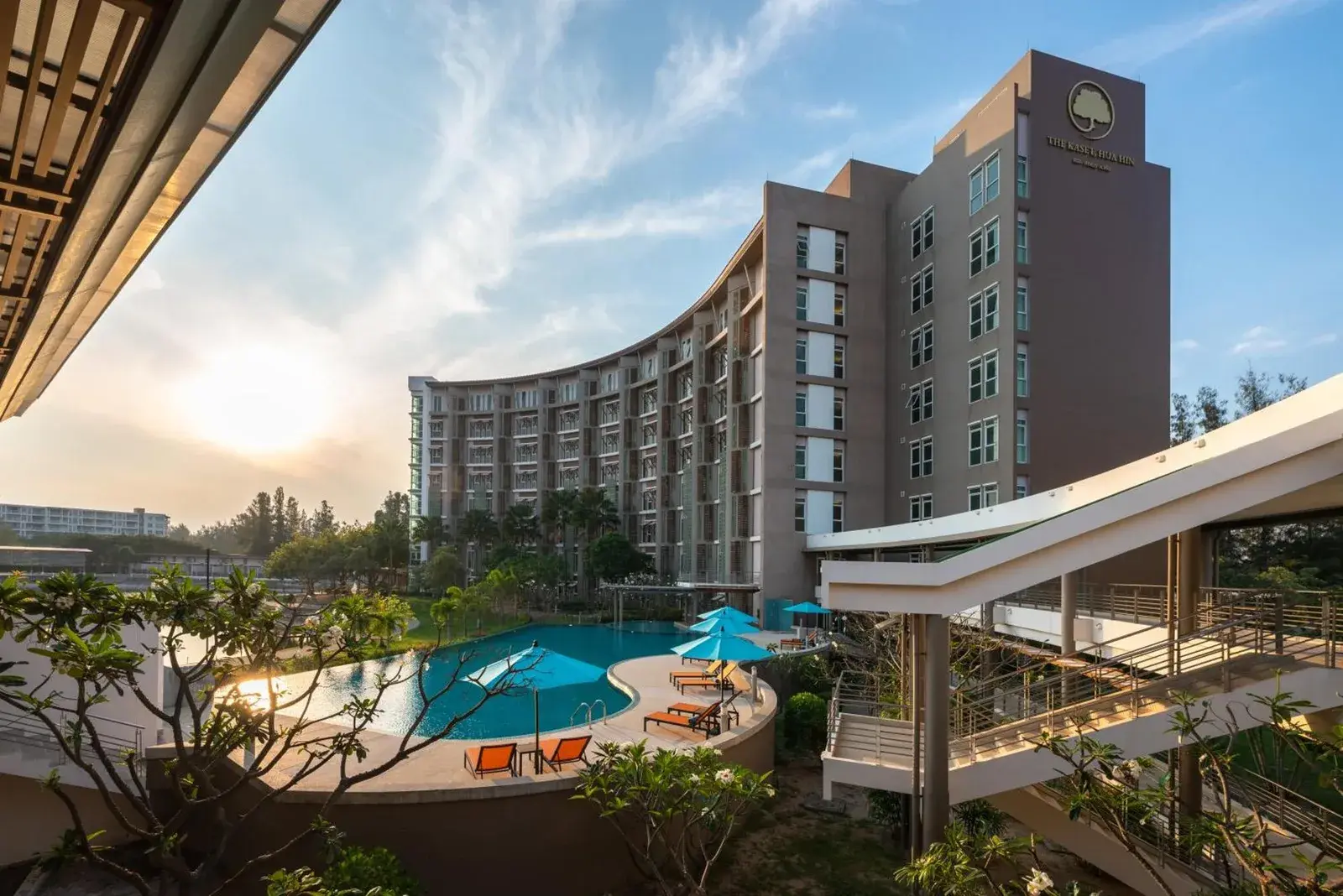 Exterior view of The Kaset, Hua Hin with the hotel building and swimming pool in Hua Hin, Thailand