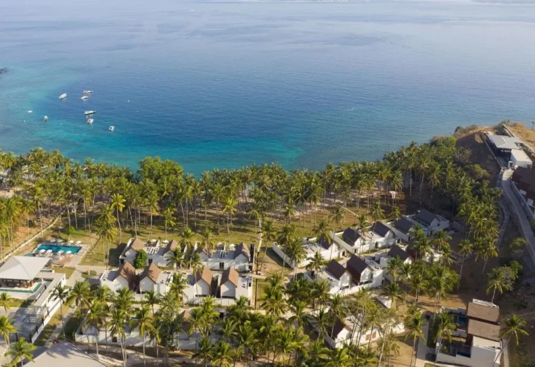 Aerial view of The Kayana Beach Lombok with palm trees