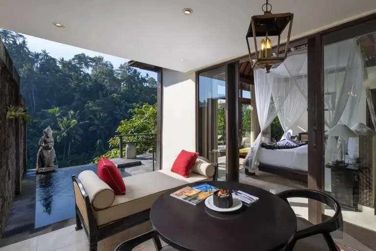 Relaxing lounge space at The Kayon Valley Resort overlooking a pool
