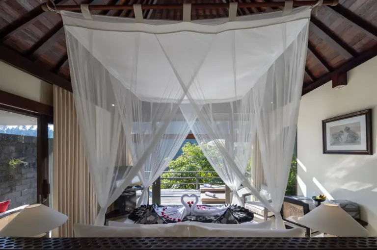 Romantic bed setup in The Kayon Valley Resort in Ubud
