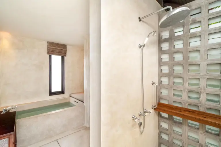 Shower and bathtub area in a bathroom at The Lamai Samui, Koh Samui
