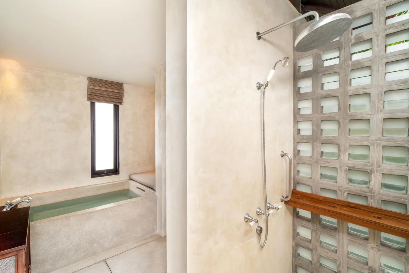 Shower and bathtub area in a bathroom at The Lamai Samui, Koh Samui