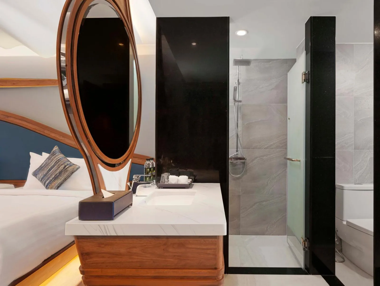 Bathroom vanity and shower area at The Oceanic Sportel Phuket - SHA Extra Plus