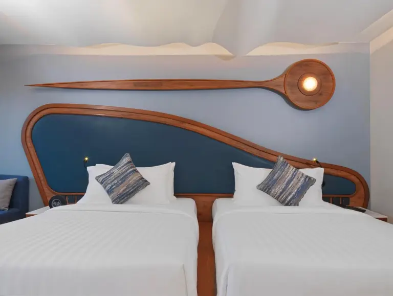 Twin beds in a guest room at The Oceanic Sportel Phuket - SHA Extra Plus Phuket