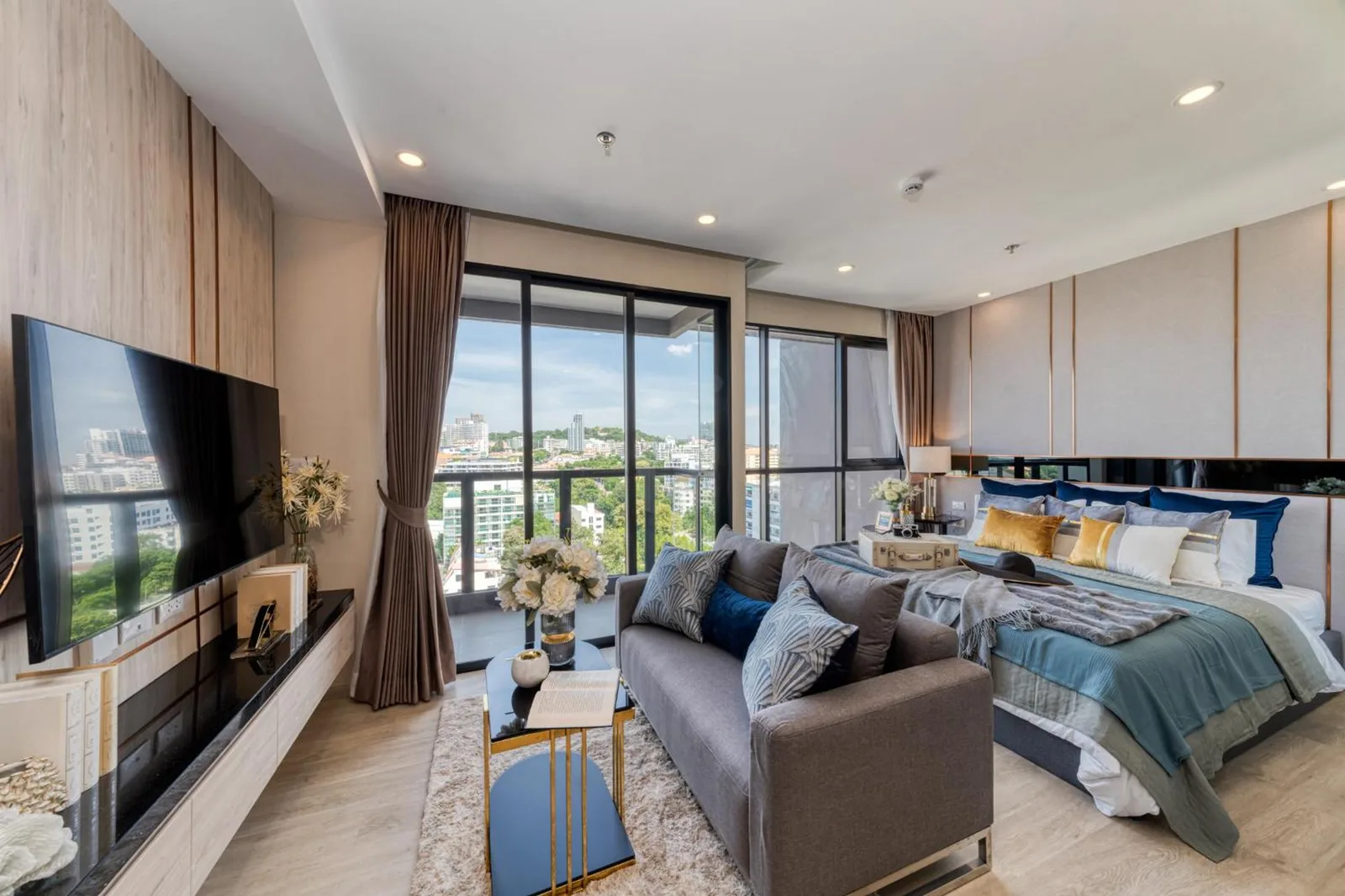 City view suite at The Panora Pattaya by PH with balcony windows and modern living area in Pattaya
