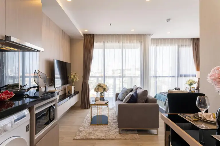 Living area and kitchenette at The Panora Pattaya by PH in Pattaya with contemporary furnishings