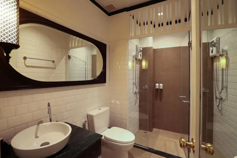 Bathroom at The Raweekanlaya Bangkok Wellness Cuisine Resort in Bangkok with sink, toilet, and shower