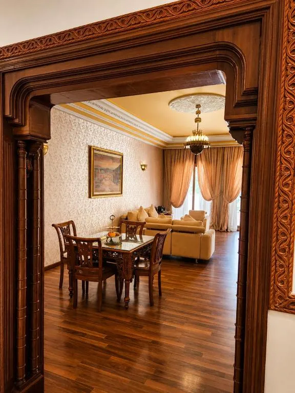 The Red House Marrakech dining space with wooden furniture