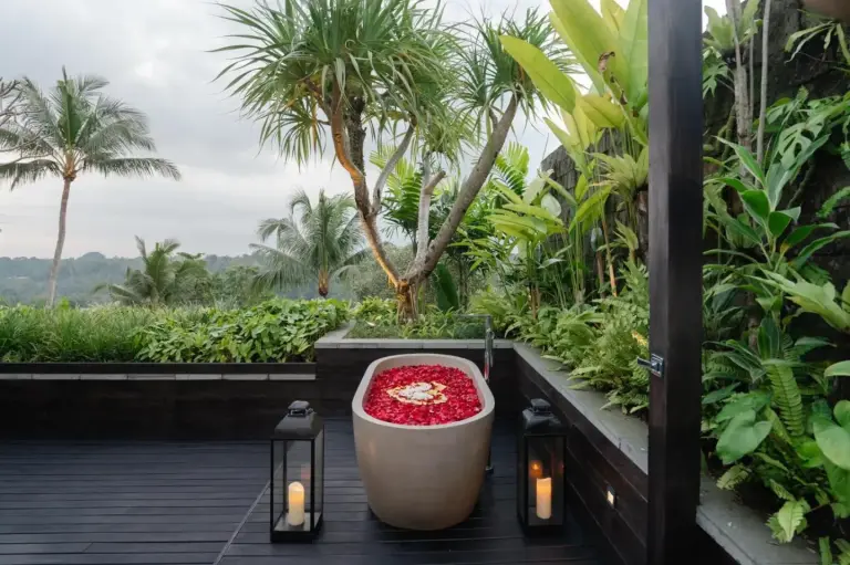 The Ridge Bali – Ubud, Indonesia hotel – a bath tub with flowers in it on a balcony at The Ridge Bali in Ubud