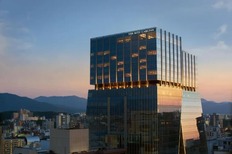 Stunning exterior of The Ritz-Carlton Fukuoka with city skyline