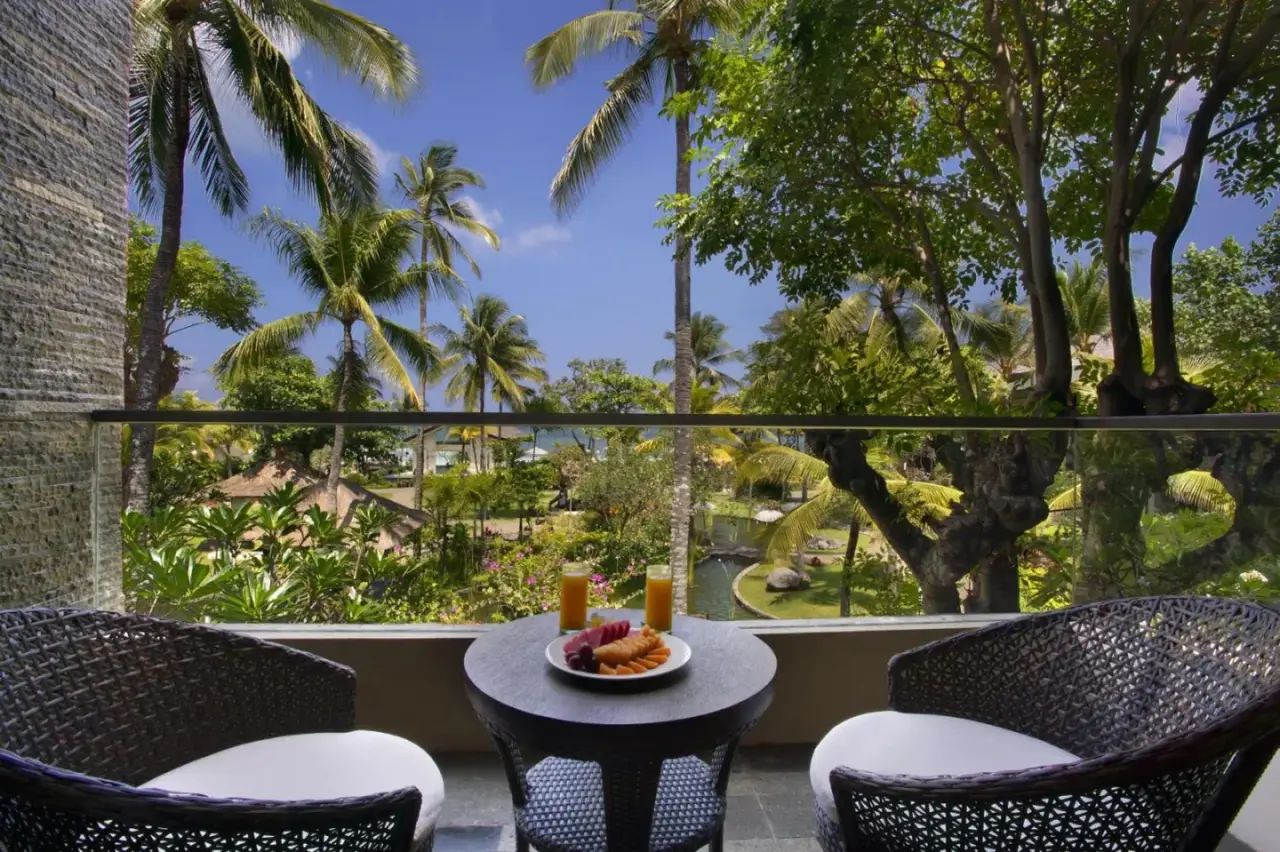 Balcony view with breakfast at The Seminyak Beach Resort & Spa