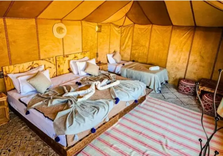 Luxury tent interior at Tinariwen Luxury Camp in Merzouga
