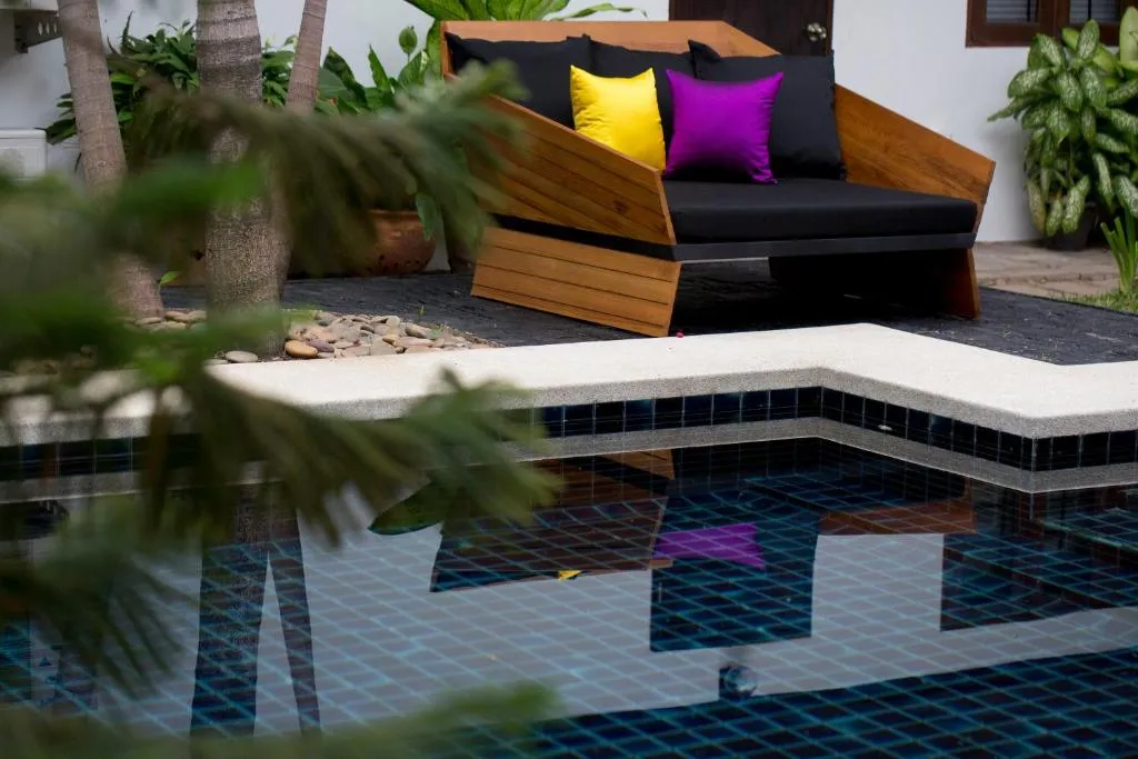 Inviting seating area by the pool at Tolani Northgate Villa Chiang Mai