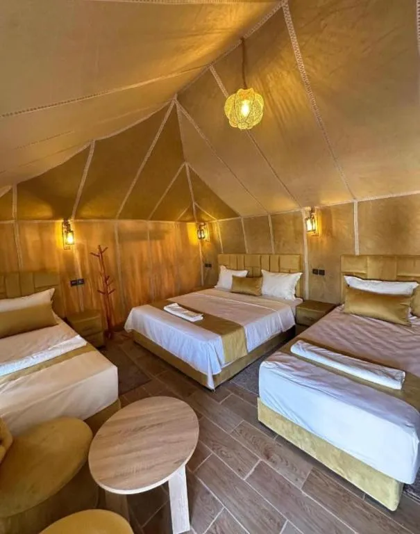 Interior of a spacious family tent at Toop Luxury Camp in Merzouga