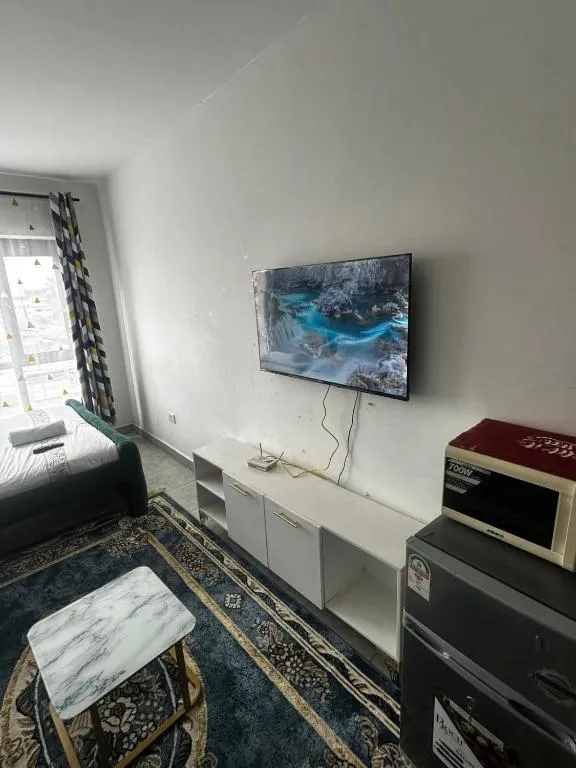 Living area at Tsavo hotel with TV and microwave