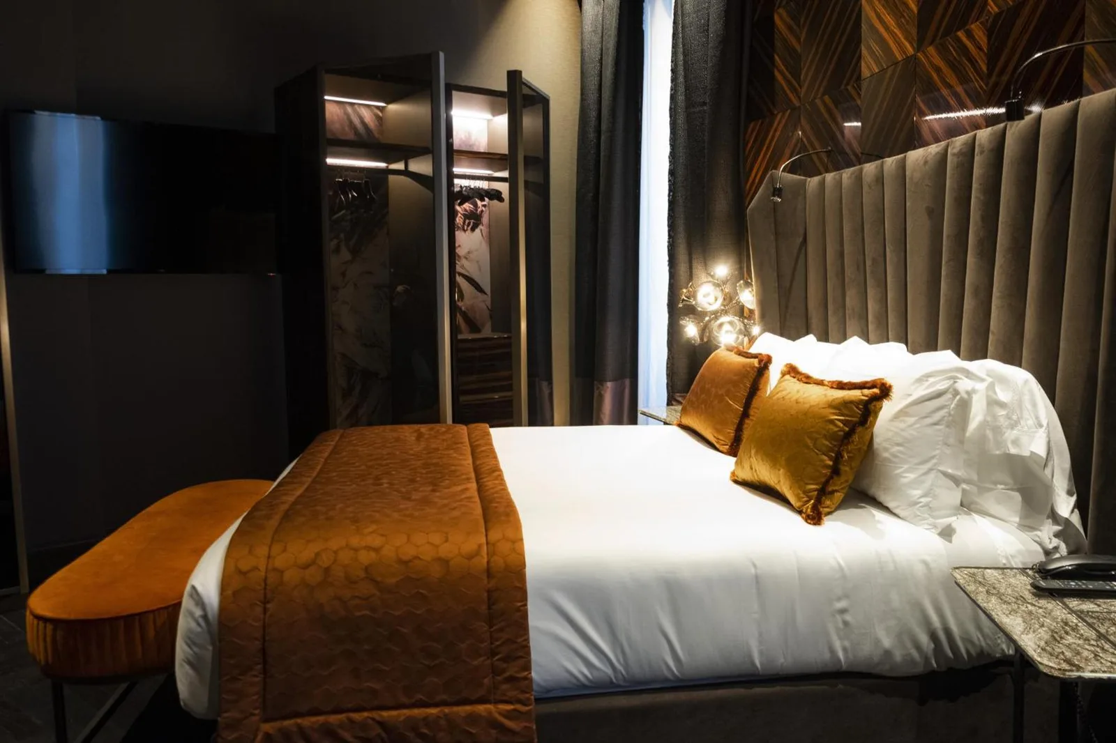 Elegant bedroom at U-Visionary Roma Hotel