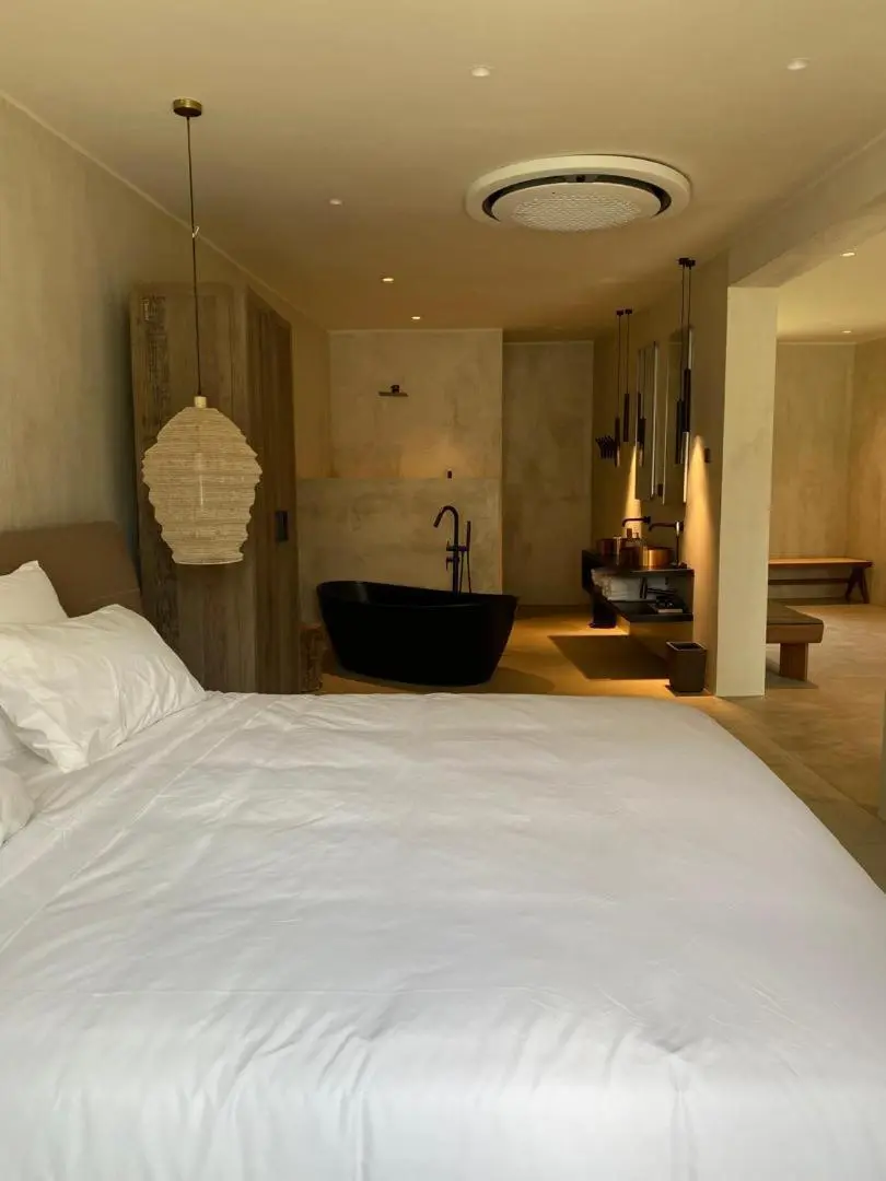 Bedroom view with modern amenities at Ubucuti Gorilla Lodge