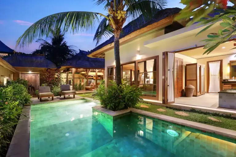 Evening view of a villa with pool at Ubud Nyuh Bali Resort & Spa