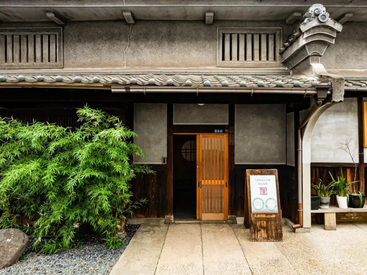 Udatsuya Hotel exterior entrance with bamboo plants in Osaka