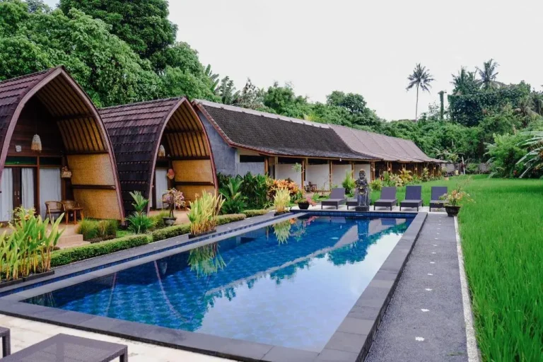 Cottages and swimming pool at Uma Raos Cottage in Bali