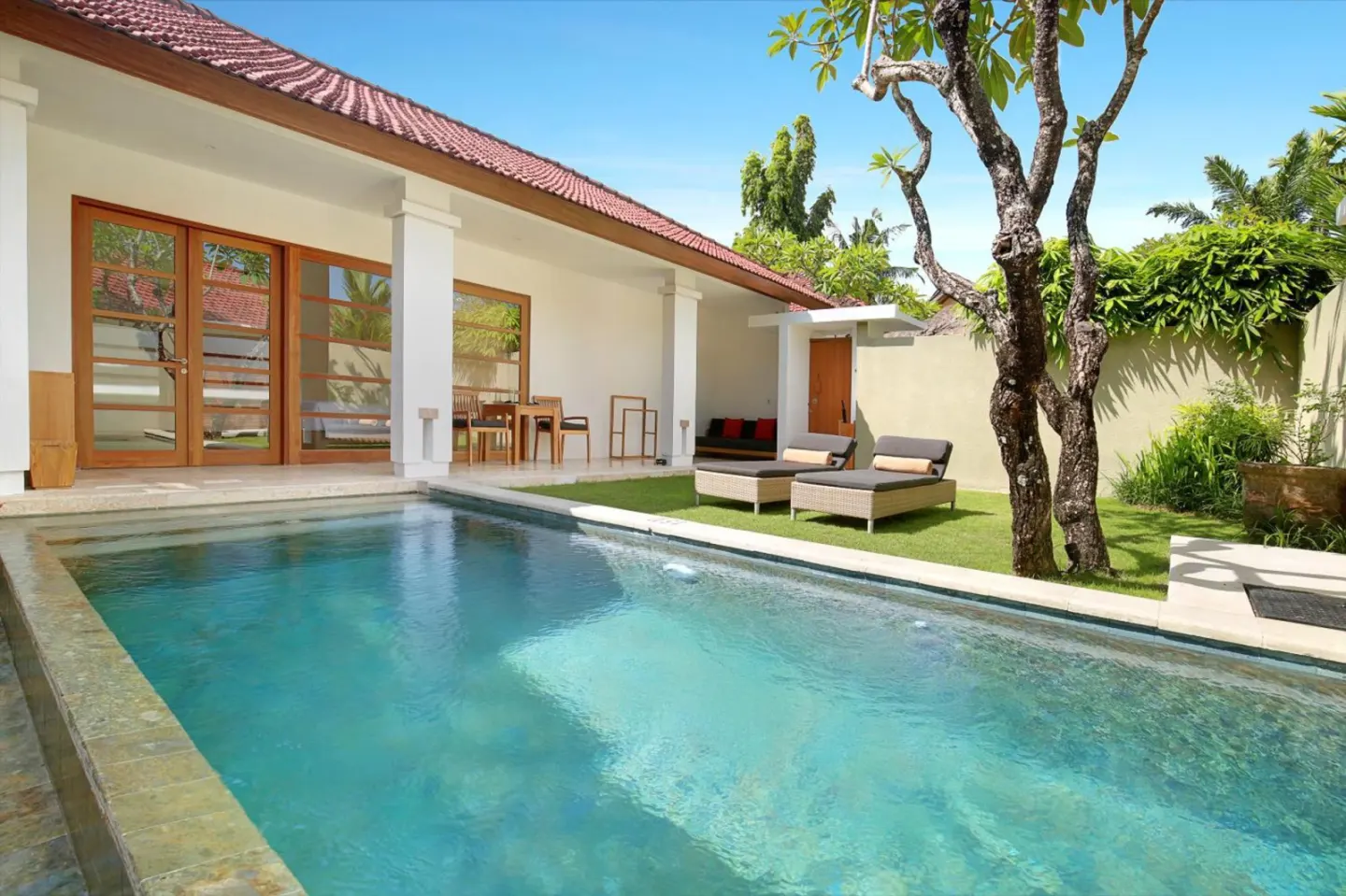 Poolside lounging area at Uma Sapna Seminyak