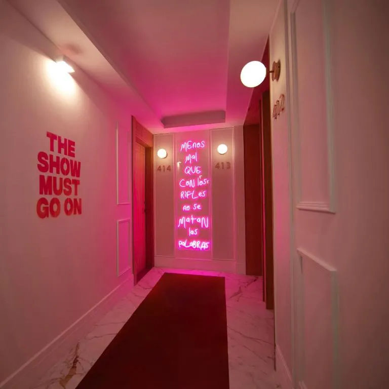 UMusic Hotel Madrid illuminated hallway with neon art