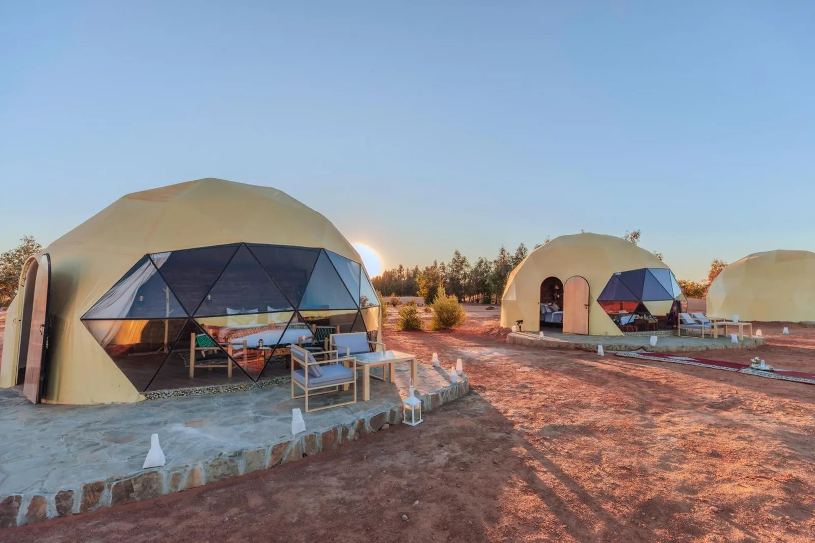 Unique Desert Camp in Merzouga exterior tents at sunset