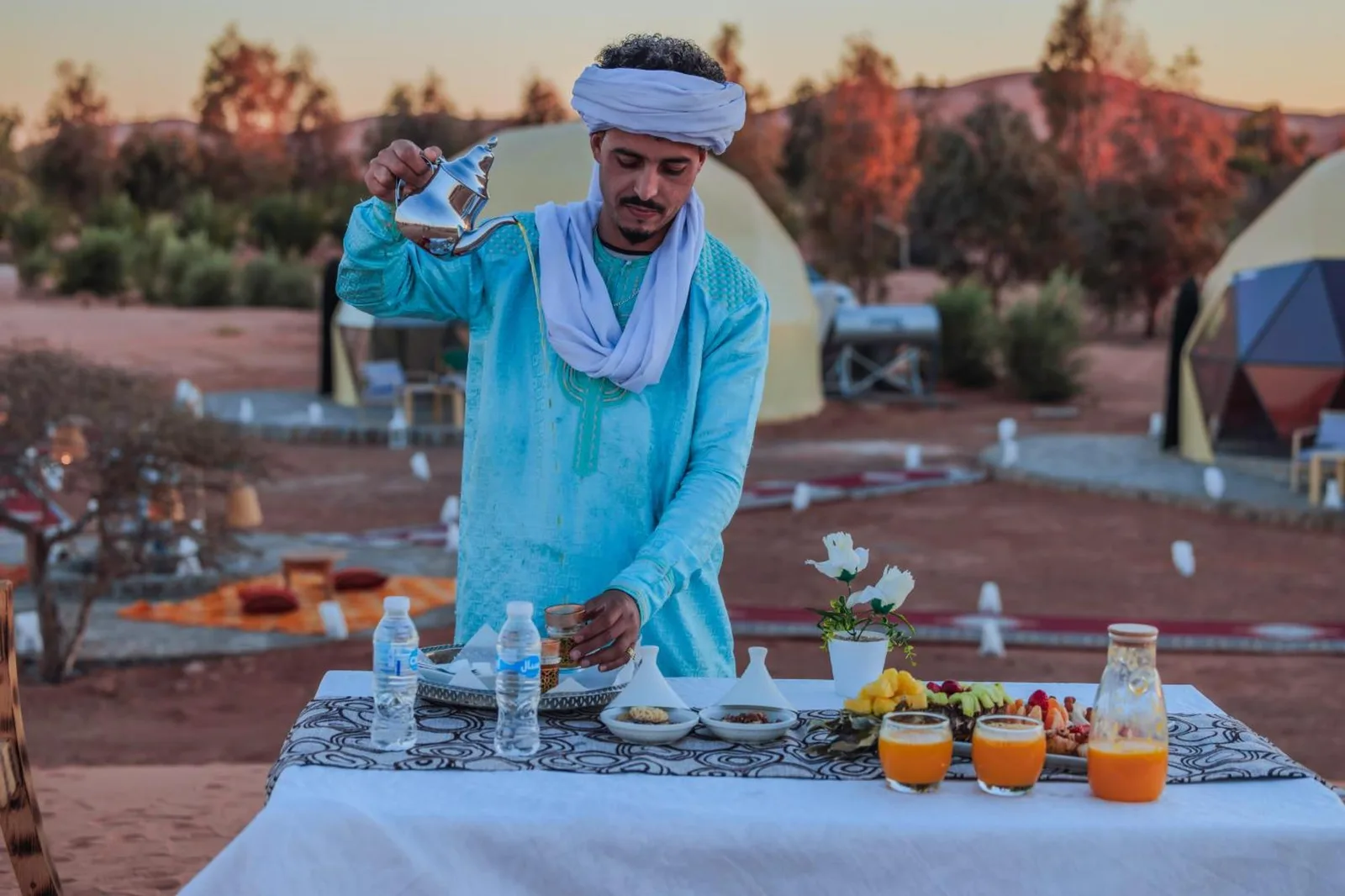 Unique Desert Camp in Merzouga tea service outdoors