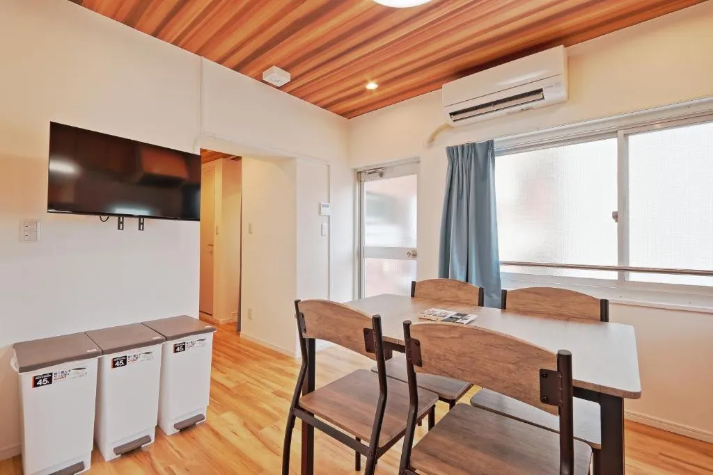 Living area with dining table at V Close to Olympic Stadium Sendagaya C in Tokyo