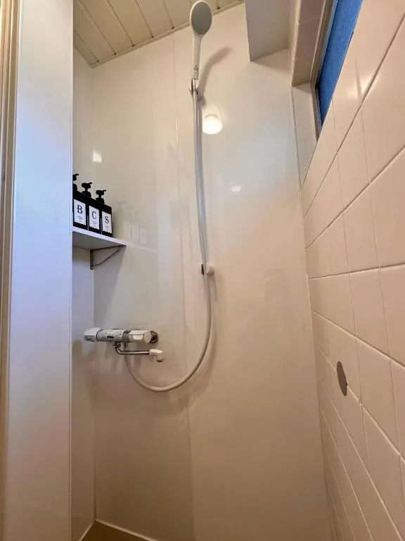 Modern shower area at V Close to Olympic Stadium Sendagaya C in Tokyo