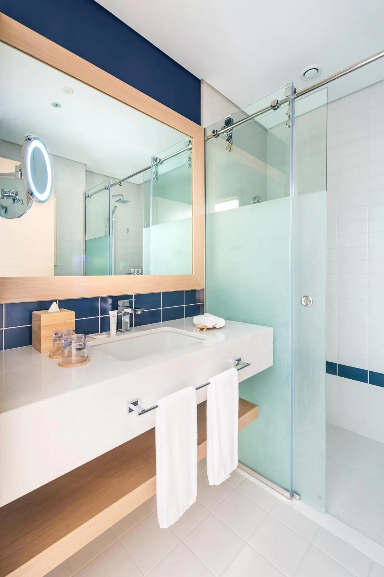 Bathroom shower and sink area in Vida Beach Resort Umm Al Quwain guest room
