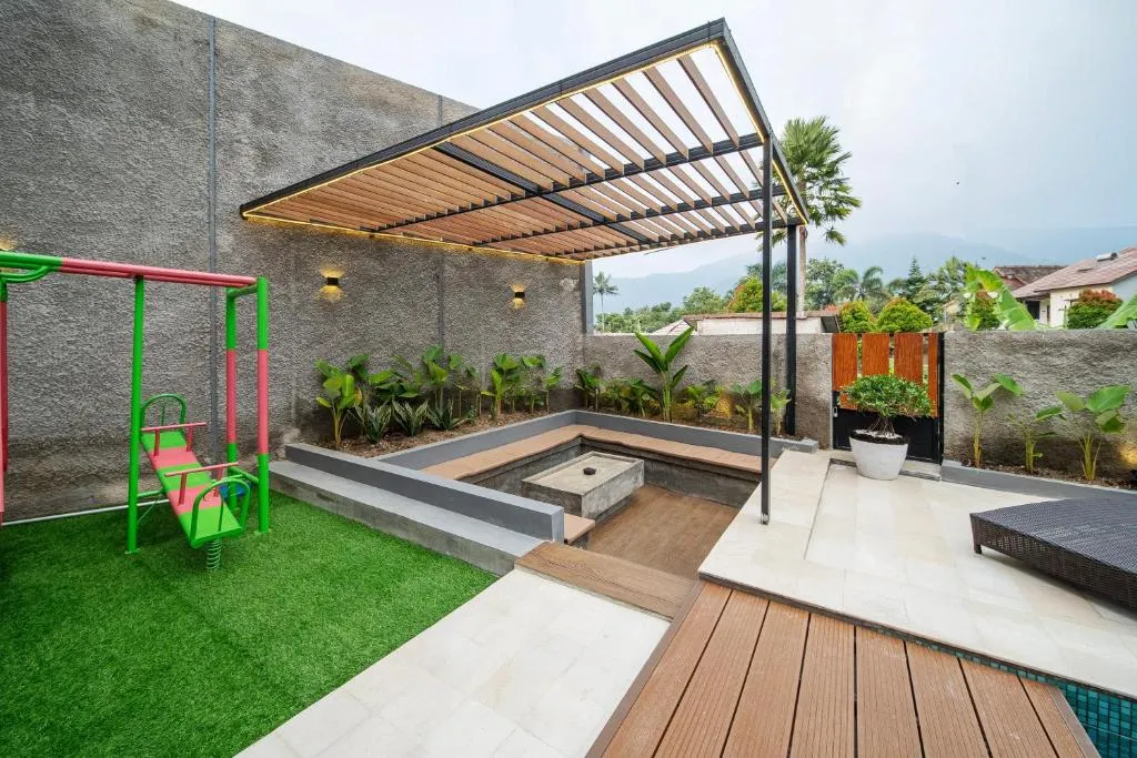 Outdoor area with playground at Villa Camilia Puncak