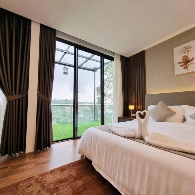 Luxury bedroom with balcony at Villa Daun