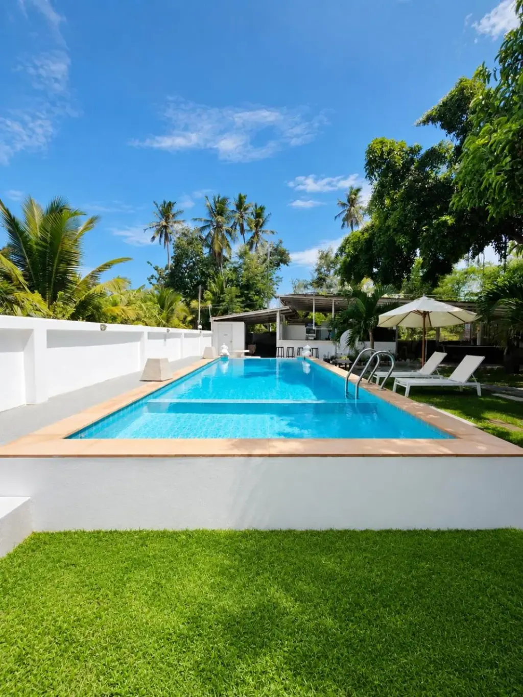 Villa Giacomelli Samui in Koh Samui featuring a private outdoor swimming pool and tropical garden setting.
