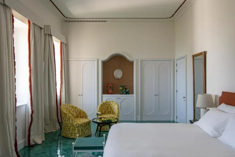 Elegant guest room interior with seating at Villa Helios Capri